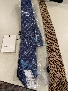 Gucci Navy/Gucci brown tie. Both for the great price.
